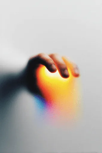 Close-up of a person's eye, partially obscured by bright red, blue, and yellow abstract shapes.